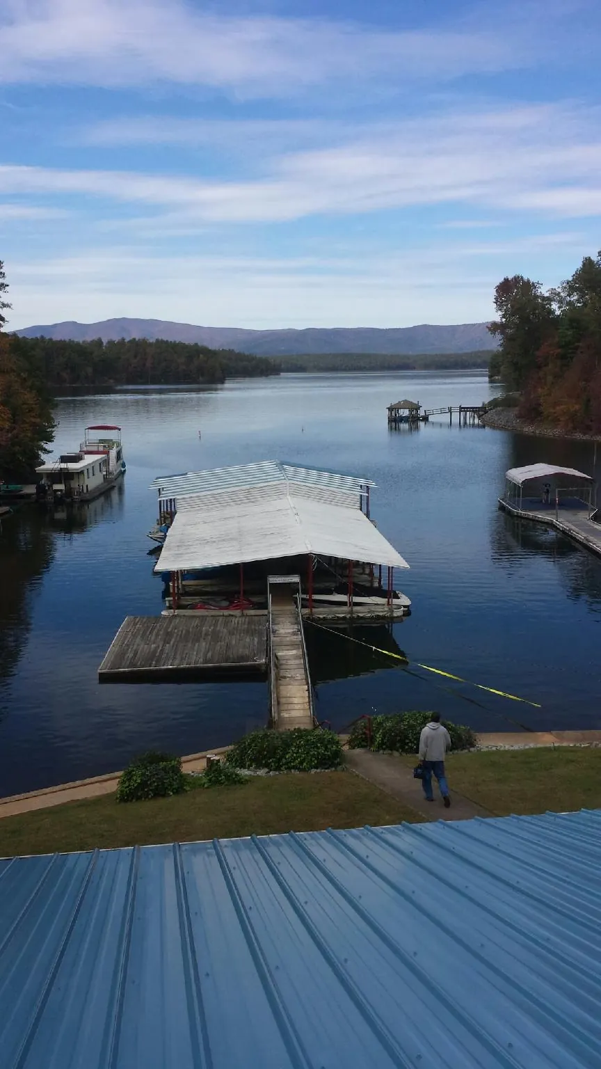 View across a lake from a newly installed blue metal roof in Brighton